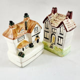 Two Antique Staffordshire House Designed Money Boxes.