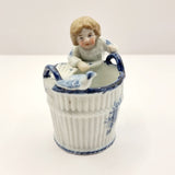 Antique German Blue and White Porcelain Figurine of Boy and Bird on Basket