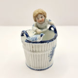Antique German Blue and White Porcelain Figurine of Boy and Bird on Basket