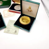 Collection of 8 Pobjot Mint Isle man Crowns along with 1979 Lesotho Coinage Set