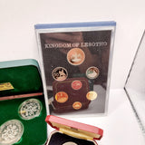 Collection of 8 Pobjot Mint Isle man Crowns along with 1979 Lesotho Coinage Set