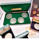 Collection of 8 Pobjot Mint Isle man Crowns along with 1979 Lesotho Coinage Set