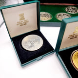 Collection of 8 Pobjot Mint Isle man Crowns along with 1979 Lesotho Coinage Set