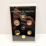 Collection of 8 Pobjot Mint Isle man Crowns along with 1979 Lesotho Coinage Set