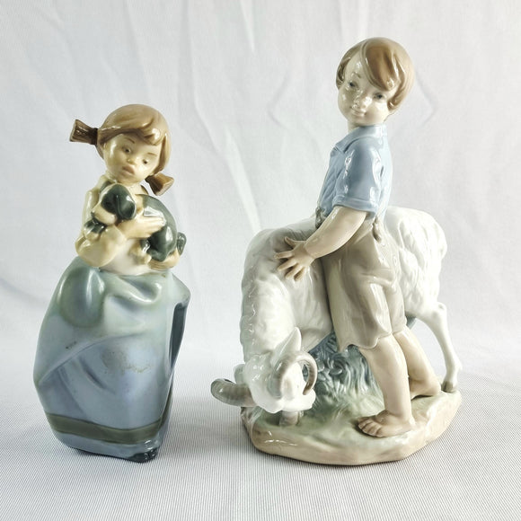 Two Nao by Lladro Figurines Boy with Goat and Girl with Dog.