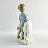 Two Nao by Lladro Figurines Boy with Goat and Girl with Dog.