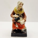 Antique Pair of Staffordshire Old man and Lady.