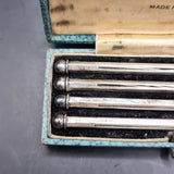 Set of Four Antique Sterling Silver Swizzle Sticks in Fitted Dorwin Case.