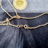 1914 Gold Half Sovereign in a 9ct Gold Mount and Chain