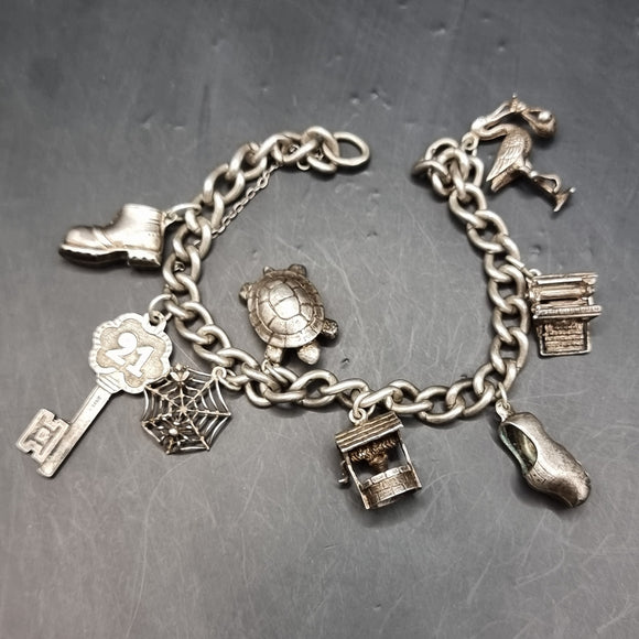 Vintage Silver Charm Bracelet with 8 Charms Typewriter Well Tortoise Stork Spider Web