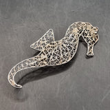 Four Vintage Silver and White Metal Wire Brooches