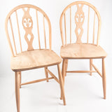 Pair of Ercol fleur-de-lis Windsor 2056 chairs