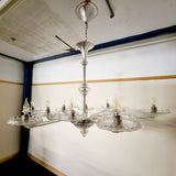 A stunning 12 branch venetian art deco chandelier, these amazing chandelier is made out of crystal glass and really reflects the light when it's on. Twelve art deco crystal glass dishes, that sit on various lengths of crystal glass arms. Giving the chandelier a sunburst look from the underneath. 