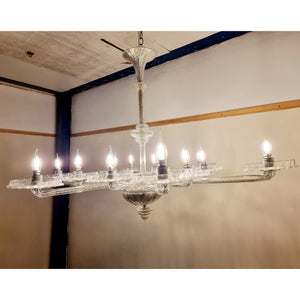 A stunning 12 branch venetian art deco chandelier, these amazing chandelier is made out of crystal glass and really reflects the light when it's on. Twelve art deco crystal glass dishes, that sit on various lengths of crystal glass arms. Giving the chandelier a sunburst look from the underneath Measurements: Height 100cm, Width 128cm, Depth 100cm.