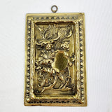 Antique Brass Plaque depicting a Boy in Foliage