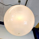 Pair of vintage industrial lights with Cast iron light fixing and a perspex ball shape shade. These have a great industrial look and style to them showing signs of wear with Scuffs and scraps to the shade of each light shade. Both lights in working order and look great hung up and lit up.   Measures: Height 60cm, Diameter approximately 36cm.