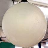 Pair of vintage industrial lights with Cast iron light fixing and a perspex ball shape shade. These have a great industrial look and style to them showing signs of wear with Scuffs and scraps to the shade of each light shade. Both lights in working order and look great hung up and lit up.   Measures: Height 60cm, Diameter approximately 36cm.