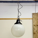 Pair of vintage industrial lights with Cast iron light fixing and a perspex ball shape shade. These have a great industrial look and style to them showing signs of wear with Scuffs and scraps to the shade of each light shade. Both lights in working order and look great hung up and lit up.   Measures: Height 60cm, Diameter approximately 36cm.