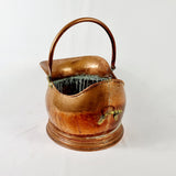 19th century Victorian copper coal scuttle. This coal scuttle features brass mounts to the side the are attached to a hinged copper handle and a single brass handle at the back of the scuttle. The coal scuttle has its normal signs of wear from being used for about 150 years as a coal scuttle should for its age, from denting of the copper from being used. Apart from that the scuttle is in very good condition, and very sturdy, ready to use straight away.  Showing back