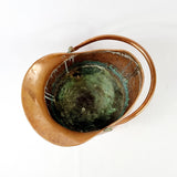 19th century Victorian copper coal scuttle. This coal scuttle features brass mounts to the side the are attached to a hinged copper handle and a single brass handle at the back of the scuttle. The coal scuttle has its normal signs of wear from being used for about 150 years as a coal scuttle should for its age, from denting of the copper from being used. Apart from that the scuttle is in very good condition, and very sturdy, ready to use straight away.  Inside slightly discoloured due to wear and age