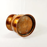 19th century Victorian copper coal scuttle. This coal scuttle features brass mounts to the side the are attached to a hinged copper handle and a single brass handle at the back of the scuttle. The coal scuttle has its normal signs of wear from being used for about 150 years as a coal scuttle should for its age, from denting of the copper from being used. Showing base 