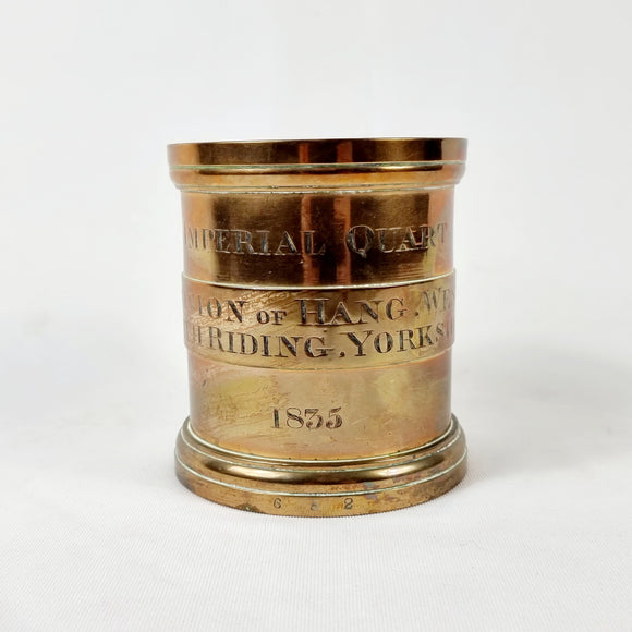 Victorian bronze imerial quart measure. Etched to the front Imperial Quart, Division of Hang, West. North Riding, Yorkshire. 1835. Numbered stamped to the bottom 652, and Royal victorian marks to the top and dated 1893 for approval of use and measure of the imperial quart. The imperial quart measures to 1/4 of a gallon. To  measure liquid or dry goods.   Measures: Height 13.5cm, Diameter 12.5cm.