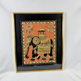 Large decorative Indian picture of an elephant made of silk, golden coloured thread and decorated in sequins. On a black background all housed within a golden frame.  Measures: Height 66.9cm, Width 56.1cm, Depth 4cm. 