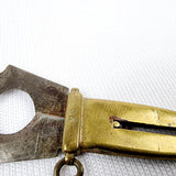 Brass and mother of pearl novelty cigar cutter in the form of a dagger. Marked M.S. This is a charming a antique cigar cutter that would make a great addition for a collector or for just having one of those one of pieces. The mother of pearl is cracked on one side of the handle bit is still securely on with no movement. Close up image of the cutter   Measures: Height 5.3cm, Width 2cm, Depth 0.5cm.
